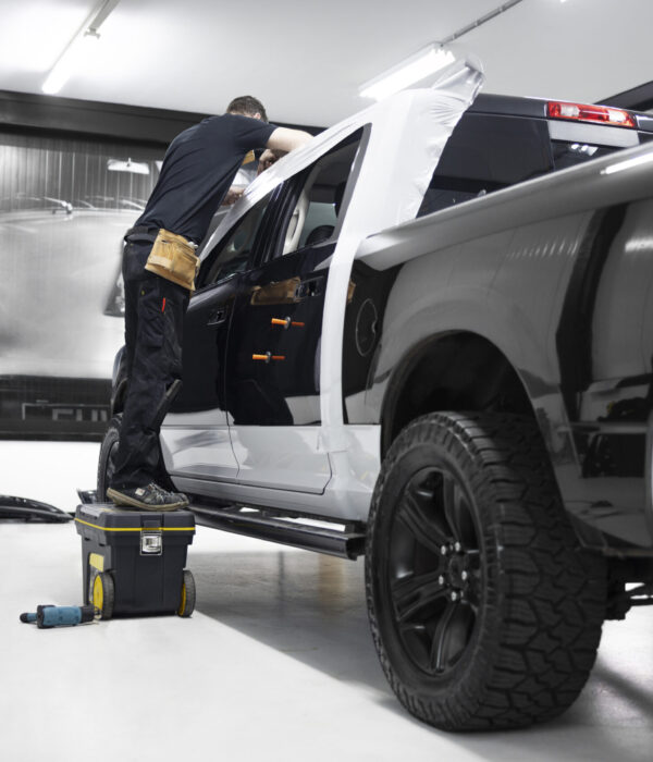 full-shot-man-wrapping-car